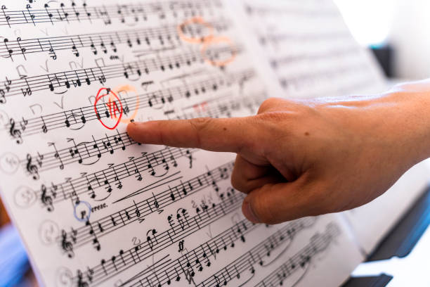 istock Musical Mastery: Young Cellist Perfecting Technique for Upcoming Concert 1498464143