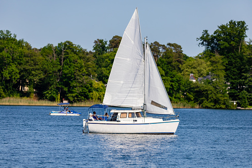 Bad Saarow, Germany - June 4, 2023, Spend a nice day with the family in the best weather on the lake with a sailing boat, copy space.