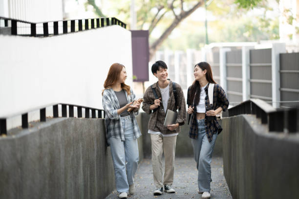istock Cheerful college students having the conversation before the classroom starts. Friendship, Education concept. 1498465798