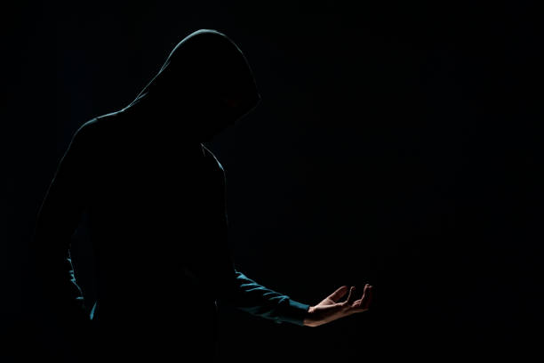 istock unknown person in the dark 1498466228