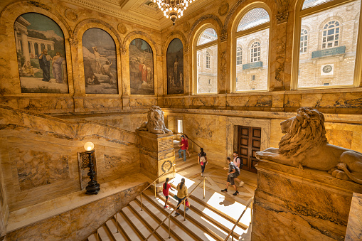 Boston, Massachusetts, USA – July 20, 2022:  Ornate interior steps and entrance of the historic Renaissance style architecture of the Boston public library in the Back Bay District neighbourhood of downtown Boston Massachusetts USA