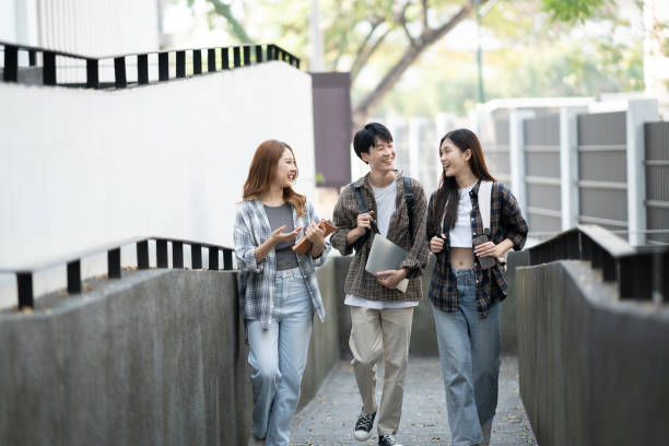 istock Cheerful college students having the conversation before the classroom starts. Friendship, Education concept. 1498467317