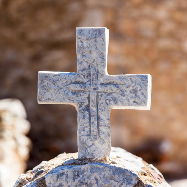 istock Greek stone cross on burial ground 1498470147