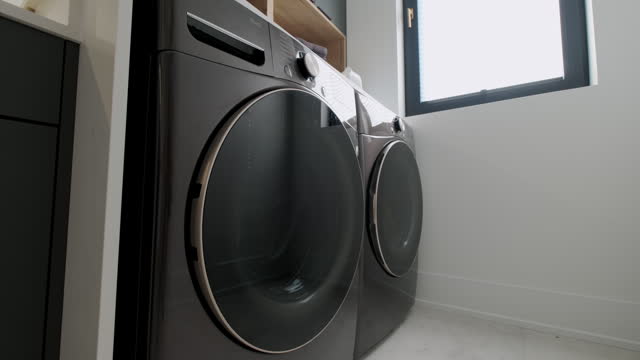 Elements of Modern Laundry room in house. Move camera