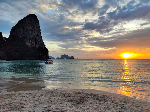 Idyllic Railay beach at sunset, one of the most famous beaches in Krabi and one of the most beautiful places in Thailand.