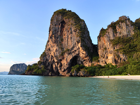 Limestone cliffs at Ao Phra Nang beach in Railay peninsula, one of the most famous beaches in Krabi and one of the most beautiful places in Thailand.