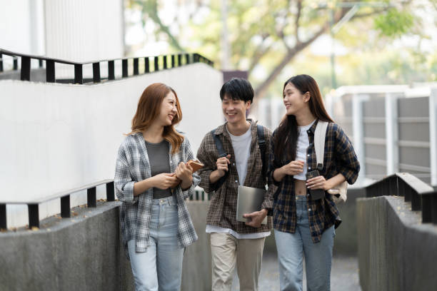 istock Cheerful college students having the conversation before the classroom starts. Friendship, Education concept. 1498477627