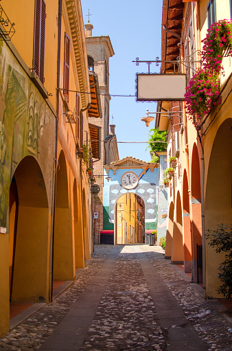 Old street of Dozza with street art on the walls, Emilia Romagna, Italy