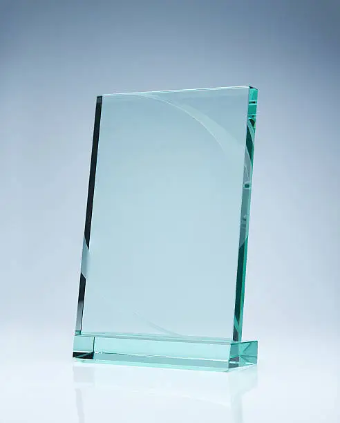 Photo of blank glass award plate with copy space