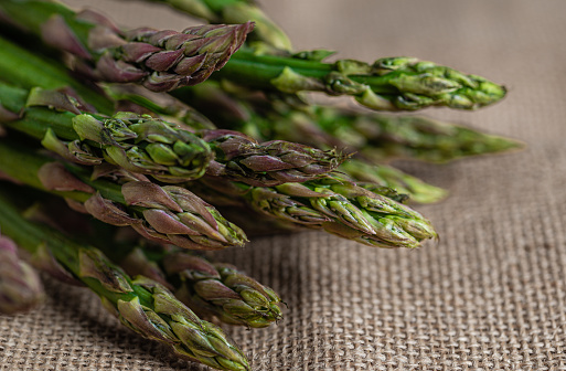 close-up of asparagus on a burlap sack, space for copying
