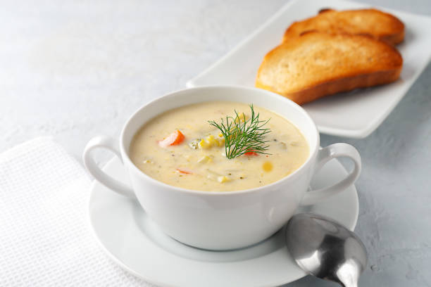 istock Thick creamy broccoli cheese soup with toast close-up on the table. 1498482795