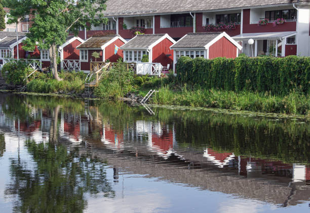 istock Scenic view of river by buildings against sky 1498483302