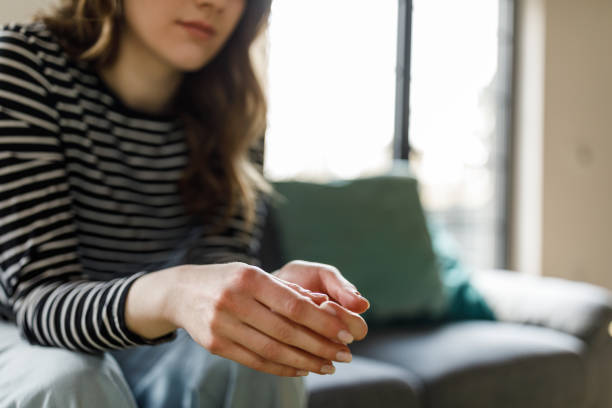 istock Anxious young woman nervously cracking her knuckles 1498485102
