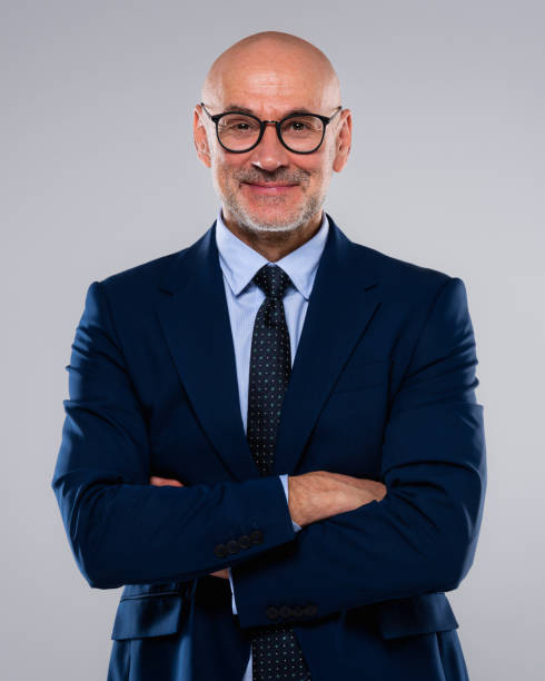 istock Executive business man standing against isolated background 1498486319