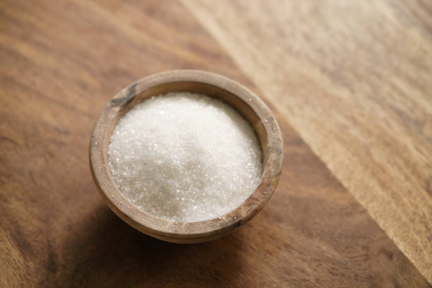 istock sugar in wood bowl on wooden table 1498496105