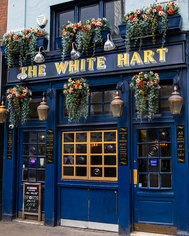 London, UK - March 2nd 2023: The exterior of The White Hart traditional public house, located on Whitechapel High Street, in London, UK.
