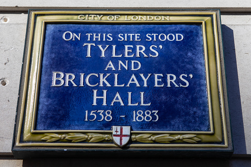 London, UK - March 2nd 2023: A blue plaque marking the location where Tylers and Bricklayers Hall once stood, in the City of London, UK.