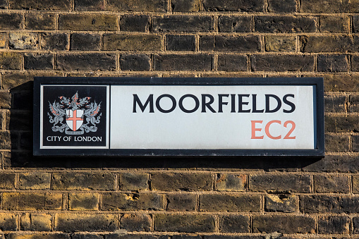 London, UK - March 2nd 2023: Close-up of a street sign for Moorfields in the City of London, UK.