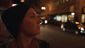teen girl on street of Chinatown in San Francisco at night