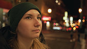 teen girl on street of Chinatown in San Francisco at night