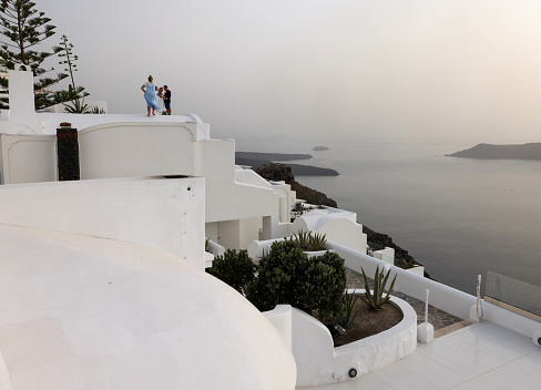 Imerovigli, Santorini, Greece - July 1, 2021: Whitewashed houses in Imerovigli on Santorini island, Cyclades, Greece