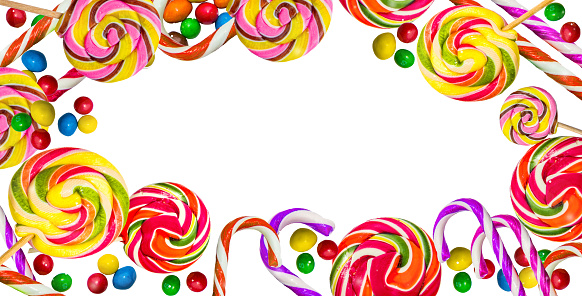 Multicolored frame of sweets. Lollipops on a white background.