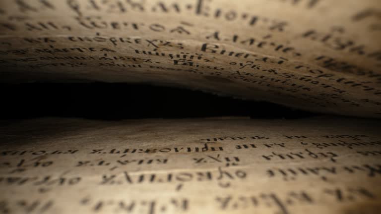 Macro background of saved medieval book with ancient writings.Archival artifacts