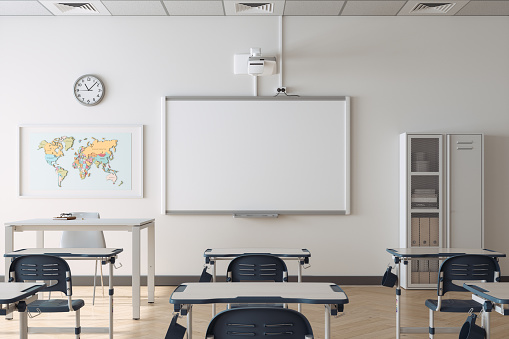 Empty Modern Classroom Interior With Desks, Chairs, Whiteboard And World Map