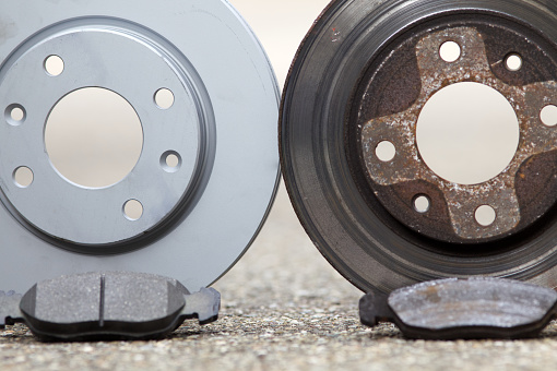car brake disk and pad. old used and new to change for safety