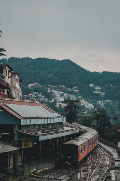 View of Shimla railway station on a rainy day - Kalka Shimla Toy Train - UNESCO World Heritage Site - Rail Transportation View of Shimla railway station on a rainy day - Kalka Shimla Toy Train - UNESCO World Heritage Site - Rail Transportation shimla stock pictures, royalty-free photos & images