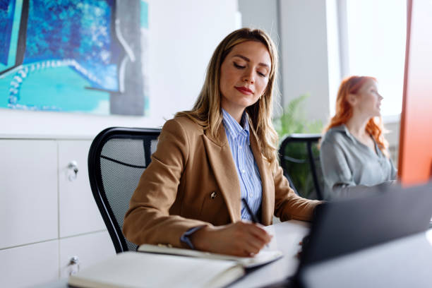 istock Beautiful woman working in the office 1498509984
