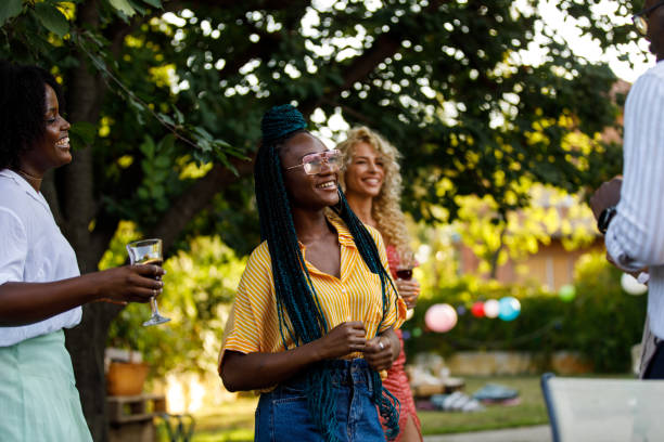 istock Young people enjoying drinks and dancing during a fun garden party 1498511353