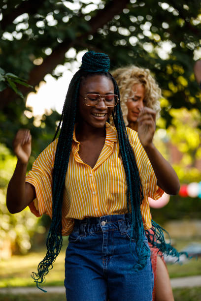 istock Young women dancing and having fun at the garden party 1498511356