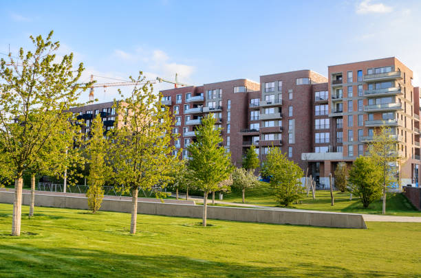 istock Modern condos along a park on a sunny spring day 1498512395