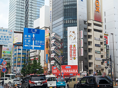 May 22, 2023 - Chiyoda, Japan: Afternoon traffic heads north on 1 Chome or Route 437 through Akihabara Electric Town. Spring time in the popular shopping district.