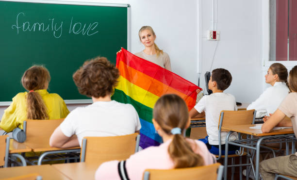 istock Teacher explaining lgbt theme to children during lesson 1498520430