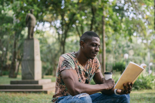 istock Reading a book in the city's public park 1498521210