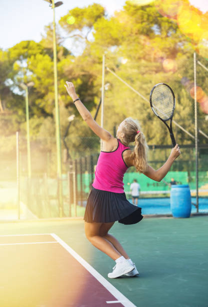 istock Active sports woman making serve while playing tennis. Racket sport training 1498521362