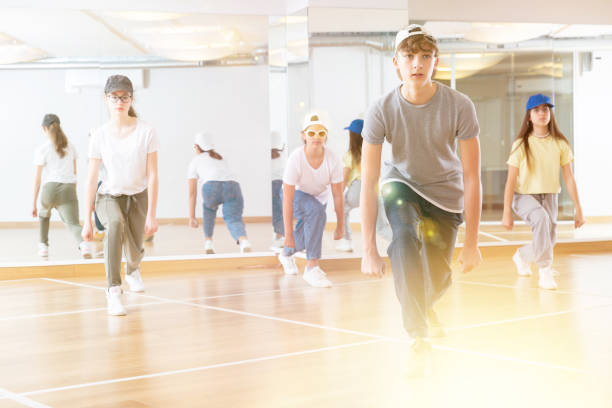 istock Happy positive teenagers learn dance movements 1498522941