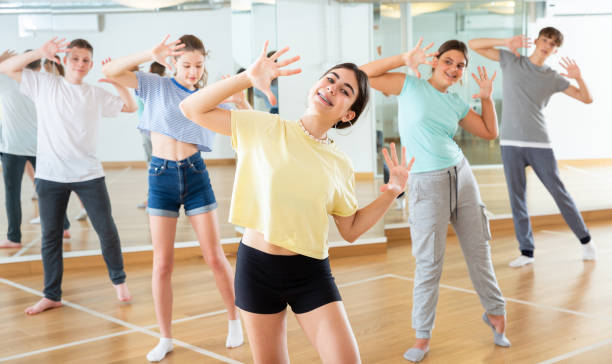 istock Teenage girl exercising during group dance class 1498522967