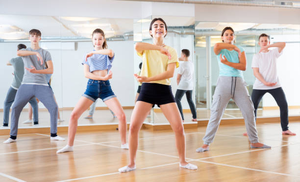 istock Teenagers in dance hall studying new movements 1498522979