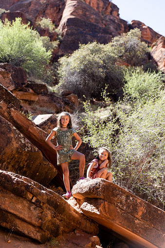 Mix Mother in her Thirties with her two girls Eight and Six Hike at Red Reef in spring at St. George Utah
Experience a delightful springtime hike at Red Reef, St. George, Utah, as a young mother in her thirties embarks on an adventure with her two vibrant daughters aged eight and six.