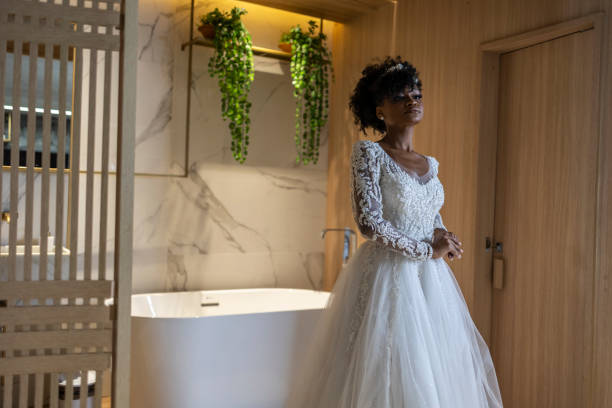 istock Black woman dressed as a bride in a hotel room 1498530896
