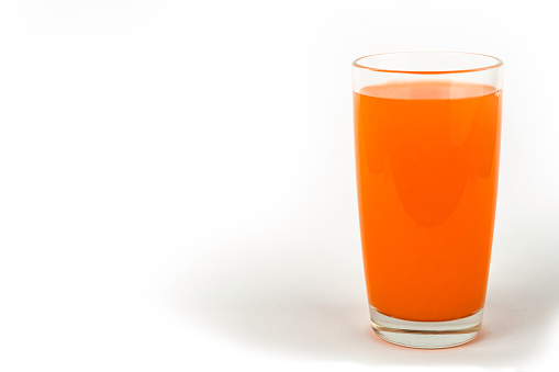 glass cup of tomato red juice isolated on white background