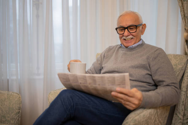 istock Senior man reading a newspaper 1498539870