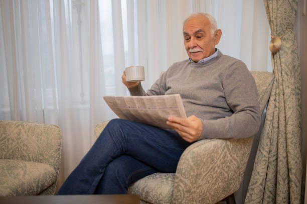 istock Senior man reading a newspaper 1498539874