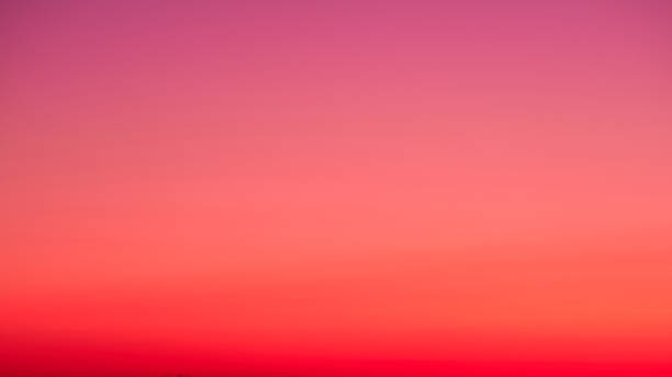 istock The clear sky turned into a beautiful gradient of oranges and pinks during sundown. 1498540009