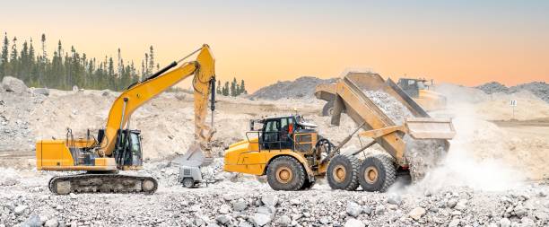 istock Excavator and dumpers working in a quarry 1498541040