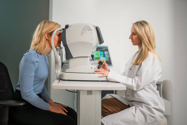 Side View of Patient and Ophthalmologist Indoors