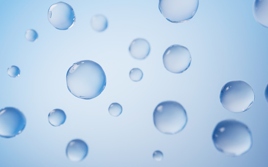 Drops of water on blue textile background